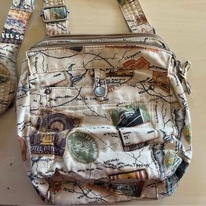 Fossil world traveler purse. Can be worn as crossbody. So many pockets!